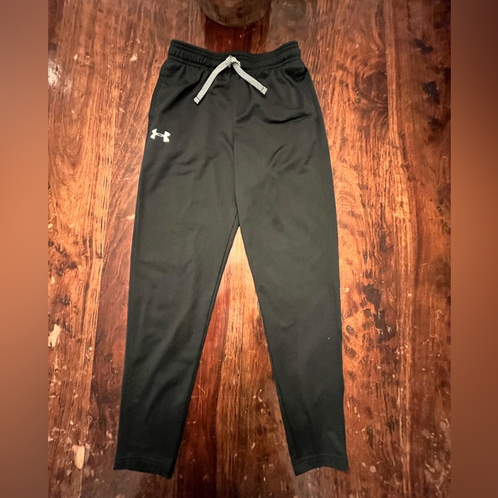 Black Under Armor track pants. Size youth large. Slightly worn.